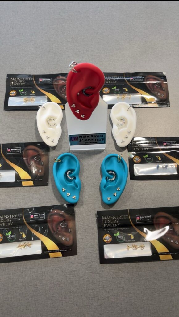 Colorful silicone ear models showcasing stud sets